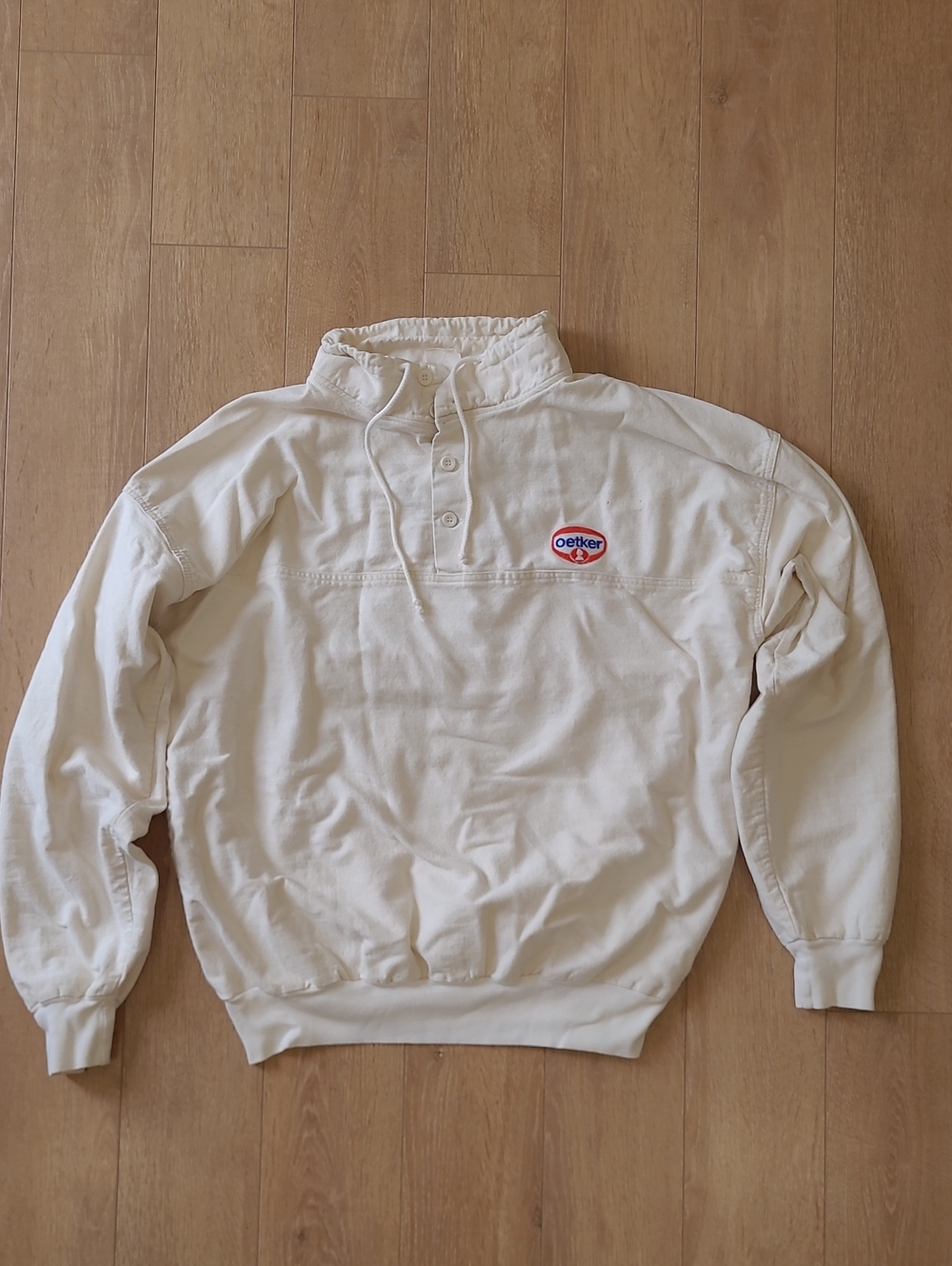 Vintage 90's Ravens Cream-Colored, Pullover Features An Embroidered Oetker